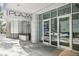 Exterior view of The Plaza Midtown building entrance with modern architectural design and clean lines at 950 W Peachtree Nw St # 1214, Atlanta, GA 30309