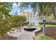 Outdoor common area featuring a fire pit, seating, and lush landscaping in a community setting at 950 W Peachtree Nw St # 1214, Atlanta, GA 30309