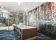 Modern conference room with a large table, comfortable seating, and a unique accent wall at 950 W Peachtree Nw St # 1214, Atlanta, GA 30309