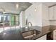 Kitchen featuring a stainless steel sink, granite countertops, stainless steel appliances and a view of the exterior at 950 W Peachtree Nw St # 1214, Atlanta, GA 30309