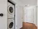 The laundry closet includes a stacked washer and dryer, maximizing space and functionality in this in-unit convenience at 950 W Peachtree Nw St # 1214, Atlanta, GA 30309