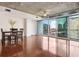 Bright, open-concept living room with hardwood floors, floor-to-ceiling windows, and city views at 950 W Peachtree Nw St # 1214, Atlanta, GA 30309