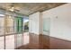 Bright living room featuring hardwood floors, city views, ceiling fan, and large windows at 950 W Peachtree Nw St # 1214, Atlanta, GA 30309