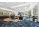 Spacious lounge area with multiple seating arrangements, a bar area, and modern decor at 950 W Peachtree Nw St # 1214, Atlanta, GA 30309