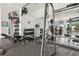 Well-equipped workout room with modern weightlifting machines and mirrored walls for effective training at 950 W Peachtree Nw St # 1214, Atlanta, GA 30309