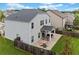 Aerial view of the home's backyard featuring a covered patio and a well-maintained lawn at 100 Grove View Rd, Woodstock, GA 30189