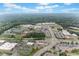 A picturesque aerial view of the property shows its location near schools and local amenities at 100 Grove View Rd, Woodstock, GA 30189