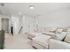 Bright bonus room with neutral color palette and plush, comfortable furniture at 100 Grove View Rd, Woodstock, GA 30189