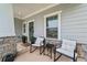 Cozy front porch seating area perfect for relaxing and enjoying the outdoors at 100 Grove View Rd, Woodstock, GA 30189