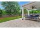 Cozy patio with comfortable seating, a ceiling fan, and a view of the grassy backyard at 100 Grove View Rd, Woodstock, GA 30189