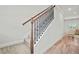 Elegant staircase with hardwood railing and carpeted steps leading upstairs at 100 Grove View Rd, Woodstock, GA 30189