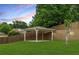 Backyard with a covered patio and a retaining wall at 3700 Long Lake Dr, Douglasville, GA 30135