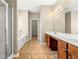 Bathroom featuring a soaking tub, walk-in shower, and double vanity at 3700 Long Lake Dr, Douglasville, GA 30135