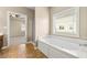 Relaxing bathroom with tub and separate shower at 3700 Long Lake Dr, Douglasville, GA 30135