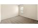 Carpeted bedroom featuring neutral-painted walls, neutral carpet and a window at 3700 Long Lake Dr, Douglasville, GA 30135