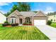 Charming brick home with a manicured lawn, attached garage, and inviting curb appeal at 3700 Long Lake Dr, Douglasville, GA 30135