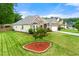 Charming brick home features a manicured lawn, two-car garage, and lovely landscaping at 3700 Long Lake Dr, Douglasville, GA 30135