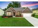 Charming brick home with a manicured lawn, attached garage, and inviting curb appeal at 3700 Long Lake Dr, Douglasville, GA 30135