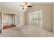 Bright living room with a vaulted ceiling, a ceiling fan, and a bay window at 3700 Long Lake Dr, Douglasville, GA 30135