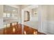 Beautiful living room featuring hardwood floors, an arched doorway, and neutral paint at 3700 Long Lake Dr, Douglasville, GA 30135