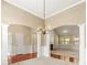 Spacious living room with a chandelier, an arched doorway, and a view of the fireplace at 3700 Long Lake Dr, Douglasville, GA 30135