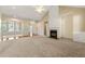 Spacious living room featuring a cozy fireplace and abundant natural light at 3700 Long Lake Dr, Douglasville, GA 30135