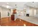 Open-concept living space featuring a fireplace, kitchen, and hardwood floors at 3700 Long Lake Dr, Douglasville, GA 30135