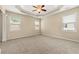 Comfortable main bedroom featuring a tray ceiling and plenty of natural light at 3700 Long Lake Dr, Douglasville, GA 30135
