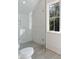 Modern bathroom features a glass shower with stylish tile work and a bright window at 490 Mount Paran Rd, Atlanta, GA 30327