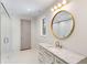 Elegant bathroom boasts a marble vanity, gold fixtures, and glass door shower, enhanced by sleek lighting at 490 Mount Paran Rd, Atlanta, GA 30327