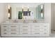 Elegant bathroom featuring a double vanity, marble countertop, and modern lighting fixtures at 490 Mount Paran Rd, Atlanta, GA 30327
