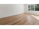 Bright bedroom with wood floors, white trim, and a large window overlooking mature trees at 490 Mount Paran Rd, Atlanta, GA 30327