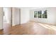 Bright bedroom with hardwood floors and large windows overlooking lush trees at 490 Mount Paran Rd, Atlanta, GA 30327