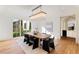 Dining room features modern chandelier, table, chairs, and outdoor view at 490 Mount Paran Rd, Atlanta, GA 30327