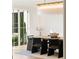 Bright dining room with modern chandelier, sleek chairs, and large windows at 490 Mount Paran Rd, Atlanta, GA 30327