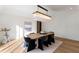 Bright dining room features modern chandelier, table, chairs, and decor at 490 Mount Paran Rd, Atlanta, GA 30327