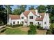 Elegant white home with a new roof, manicured landscaping, and a classic design at 490 Mount Paran Rd, Atlanta, GA 30327