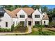 Charming home with lush landscaping, a well-kept lawn, and brick accents creating curb appeal at 490 Mount Paran Rd, Atlanta, GA 30327