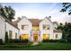 Stunning two-story home featuring a manicured front yard, stone accents, and a welcoming entrance at 490 Mount Paran Rd, Atlanta, GA 30327