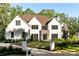 Gorgeous front exterior with pristine landscaping, stone accents and stately brick driveway at 490 Mount Paran Rd, Atlanta, GA 30327