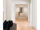 Inviting hallway features hardwood floors, white walls, and a stylish console table with decor at 490 Mount Paran Rd, Atlanta, GA 30327