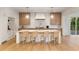 Modern kitchen with white cabinets, center island with seating, marble countertops, and stainless-steel appliances at 490 Mount Paran Rd, Atlanta, GA 30327