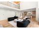 A view of the living room that shows a second story loft, high ceilings, and hardwood flooring at 490 Mount Paran Rd, Atlanta, GA 30327