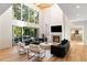 Spacious, light-filled living room with high ceilings, modern fireplace, and seamless access to outdoor patio at 490 Mount Paran Rd, Atlanta, GA 30327
