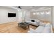 Bright living room boasts hardwood floors, a ceiling fan, a neutral color scheme and modern decor at 490 Mount Paran Rd, Atlanta, GA 30327