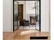 View through glass doors into living room with fireplace and built-in shelving at 490 Mount Paran Rd, Atlanta, GA 30327