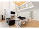 Inviting living room with fireplace, high ceilings, second story gallery and hardwood floors at 490 Mount Paran Rd, Atlanta, GA 30327