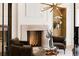 Inviting living room featuring a fireplace, modern lighting, and comfortable seating at 490 Mount Paran Rd, Atlanta, GA 30327