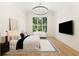 Bright main bedroom with high ceilings, a large window, and a comfortable seating area at 490 Mount Paran Rd, Atlanta, GA 30327
