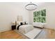 Bright main bedroom with high ceilings, a large window, and a comfortable seating area at 490 Mount Paran Rd, Atlanta, GA 30327